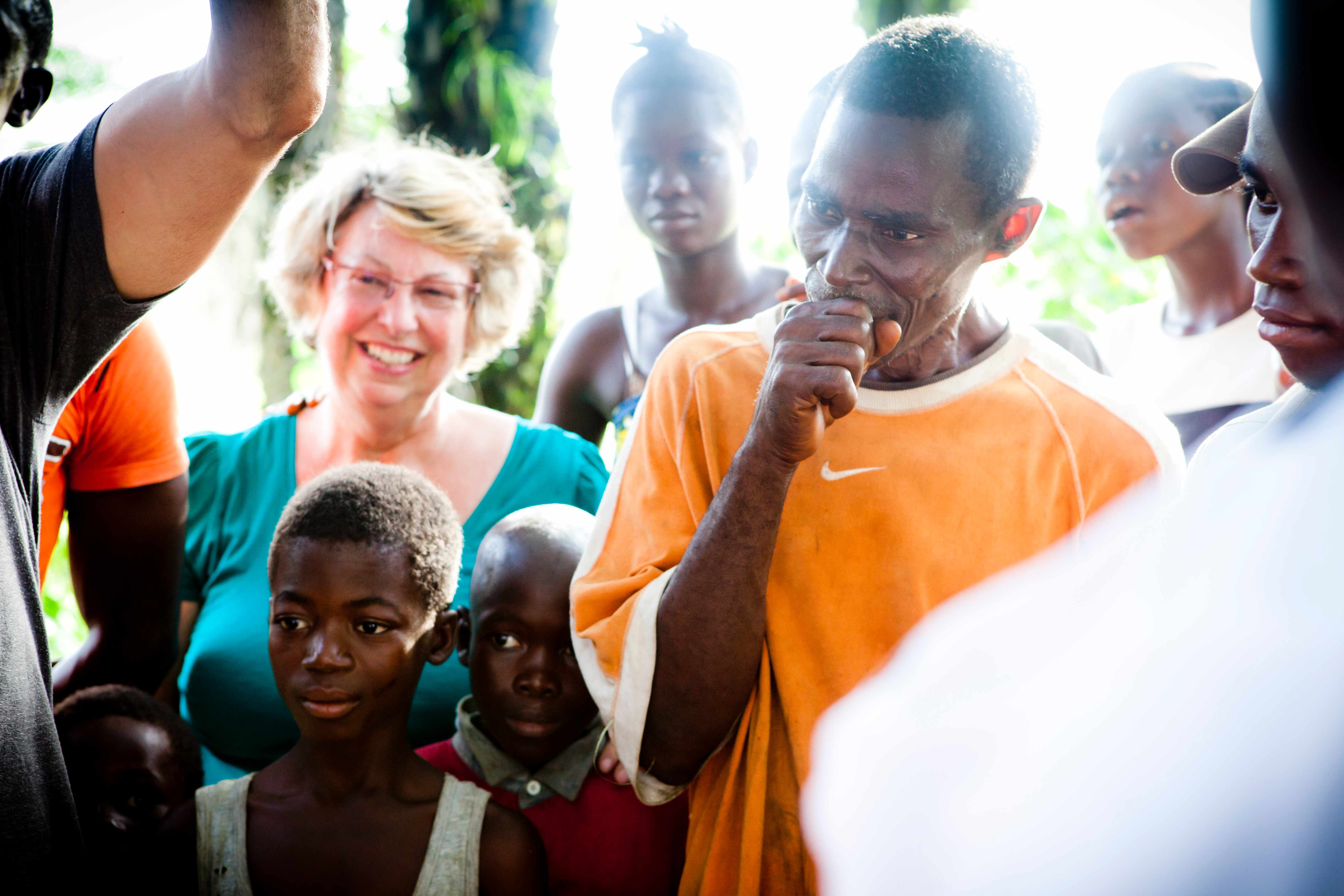 business mentor with clients, upscale retreat environment